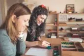 Montessori 6-12 education, students with materials