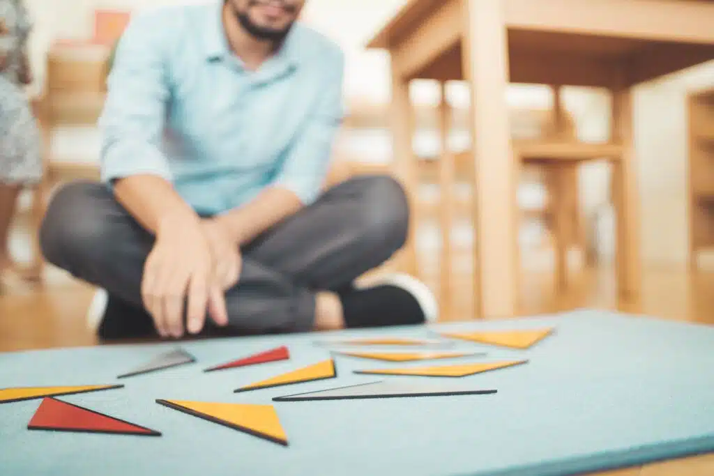 A course participant working with Montessori geometry material