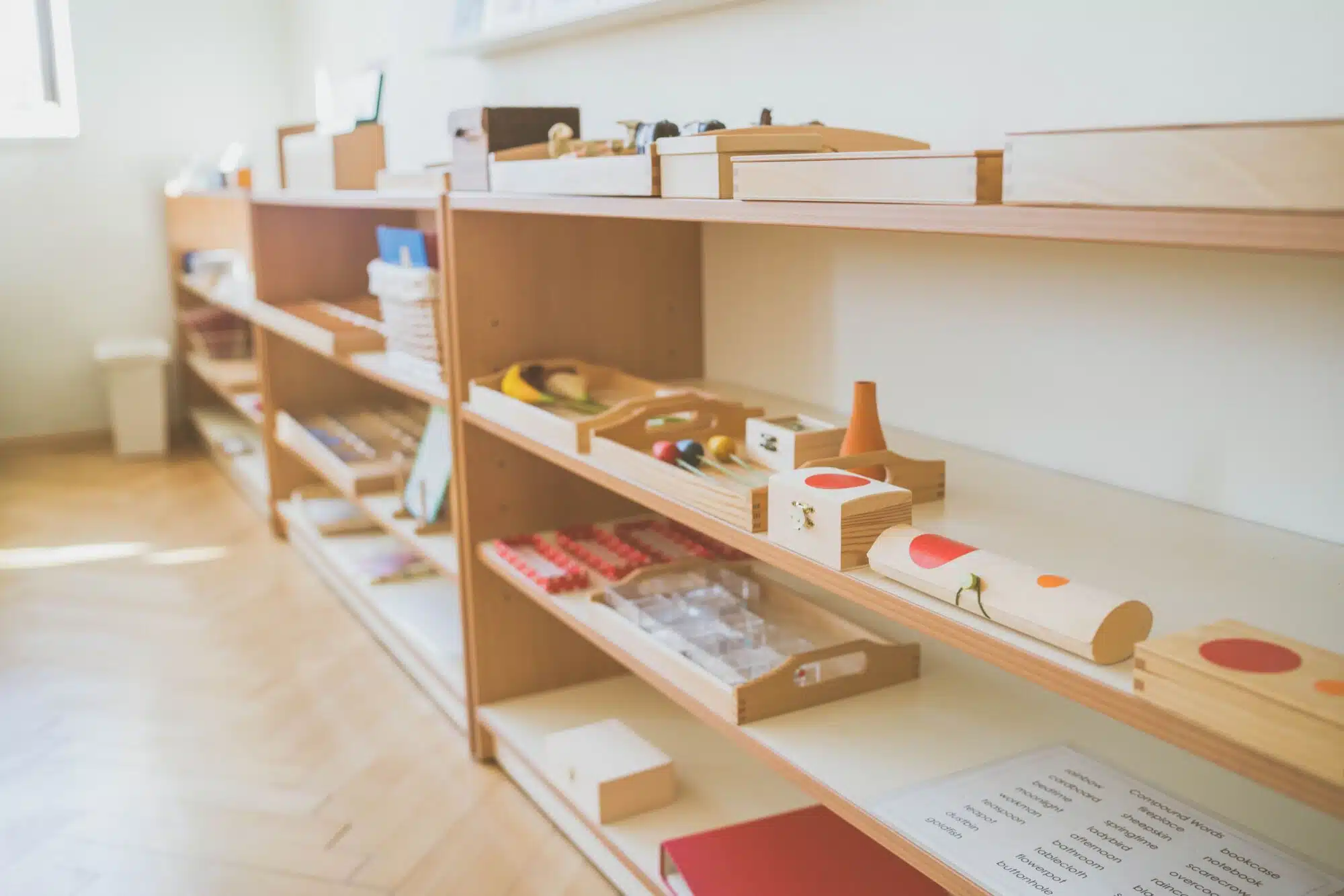 Materials on open shelves in a Montessori 3-6 classroom